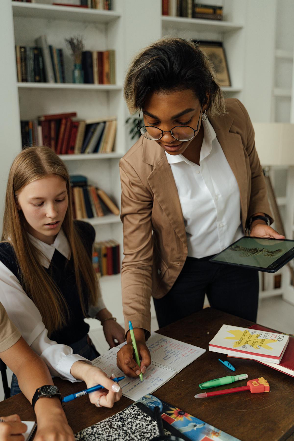 Teacher and learner using a tablet in a modern classroom