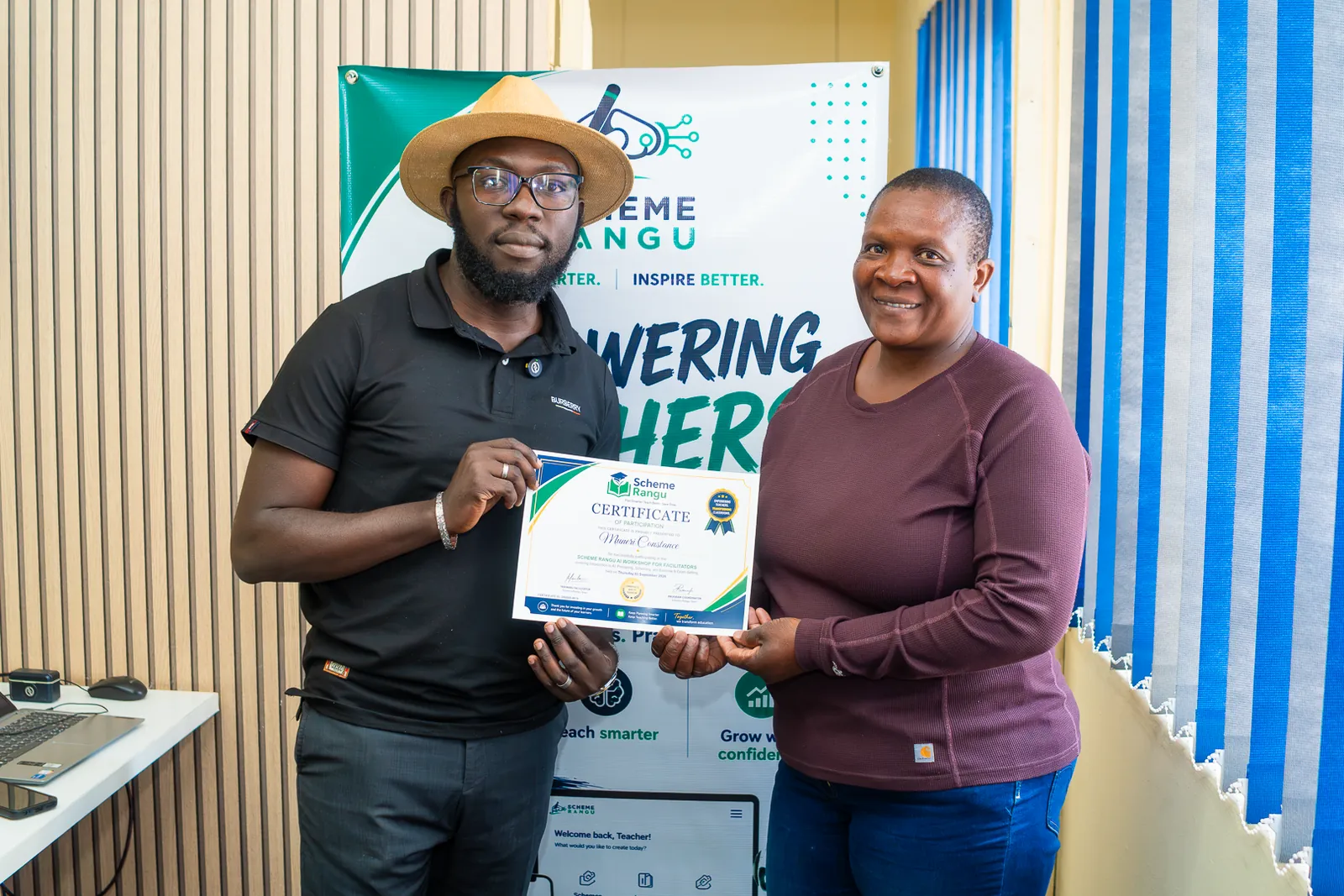 A Harare participant in a purple top receiving her workshop certificate